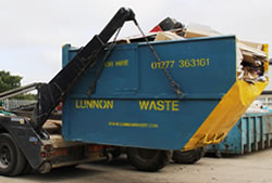 Skip Hire Bishops Stortford full skip being unloaded